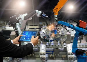 Robotic arms in a factory setting controlled by a technician with a tablet, showcasing automation and advanced manufacturing processes.